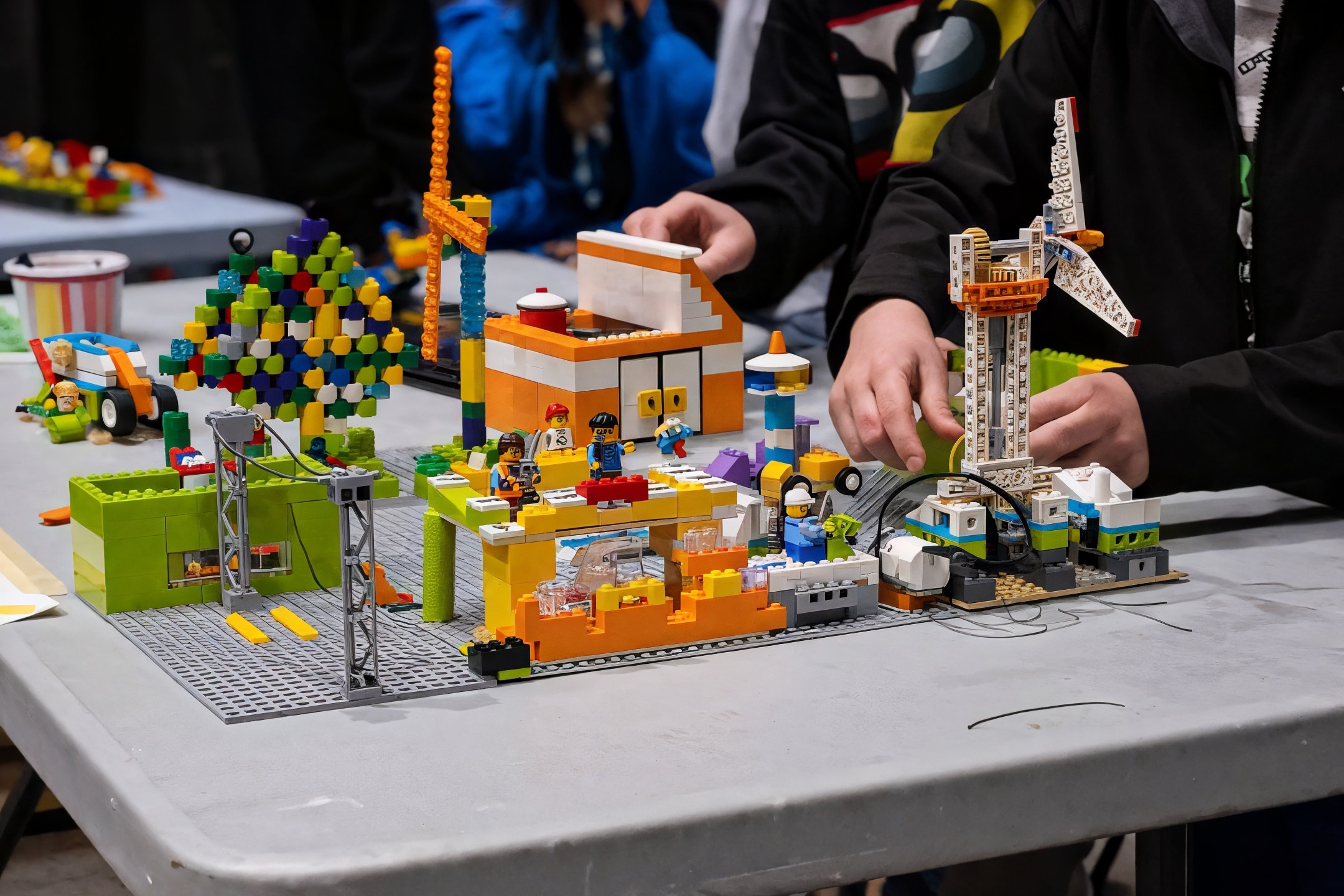 Students building an imaginative LEGO robotics project